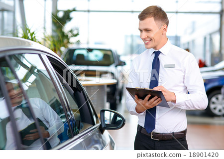 Pleasant sale assistant being involved in work 18901420