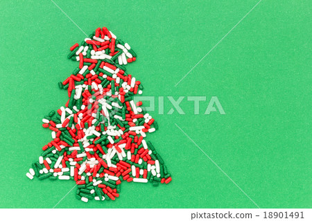 一棵杉樹用聖誕節顏色頂部糖 一棵杉樹用聖誕節顏色頂部糖 18901491