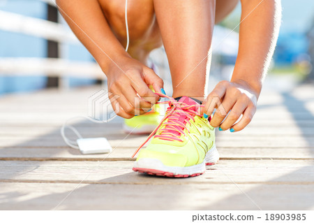 Running shoes - woman tying shoe laces 18903985