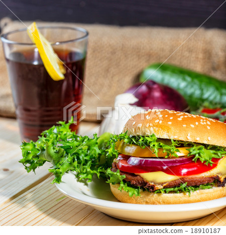 hamburger and drink with slice of lemon hamburger and drink with slice of lemon 18910187