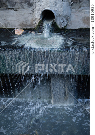 Sewer drain pipe dirt and patches of moss. 18910989