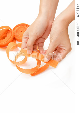 hand holding  roll of velco on white background  18911152