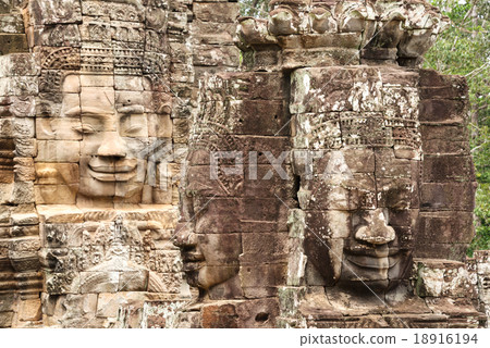 Stone head on towers of Bayon temple  18916194