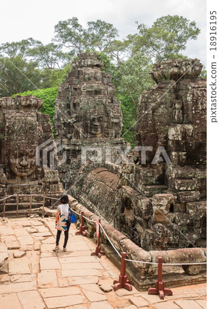 Stone head on towers of Bayon temple Stone head on towers of Bayon temple 18916195