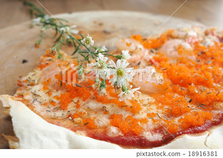Homemade pizza on wooden table 18916381