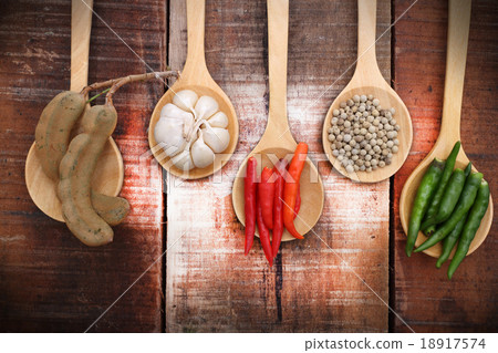Spices and herbs in wooden spoons. Spices and herbs in wooden spoons. 18917574