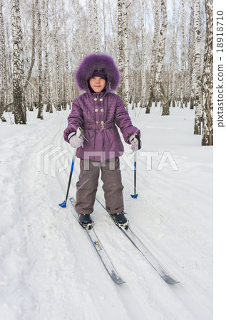 Winter portrait of the girl of four years on skis Winter portrait of the girl of four years on skis 18918710