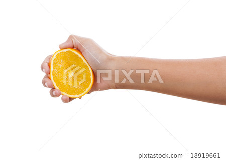 A female hand holding an orange slice 18919661