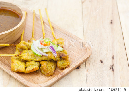 Grilled pork satay with peanut sauce. 18921449