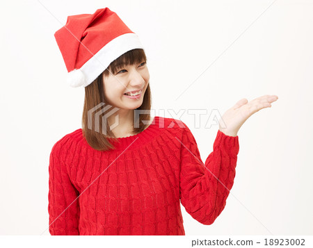 Women wearing a Santa hat Women wearing a Santa hat 18923002