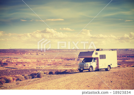 Retro toned camper parked by canyon. Retro toned camper parked by canyon. 18923834