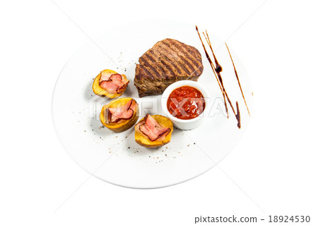 beautiful steak with a side dish of potatoes beautiful steak with a side dish of potatoes 18924530