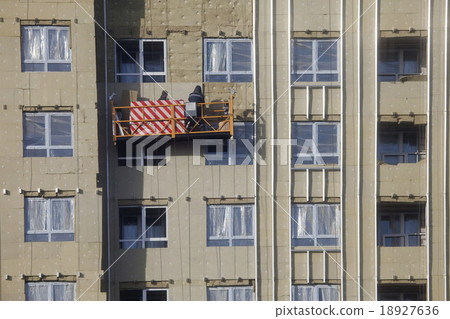 Construction of the building. Workers warm outside Construction of the building. Workers warm outside 18927636