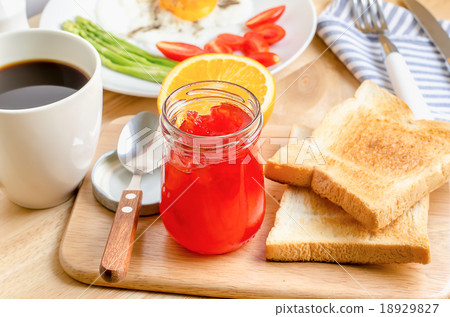 Healthy breakfast with toasts and strawberry jam Healthy breakfast with toasts and strawberry jam 18929827