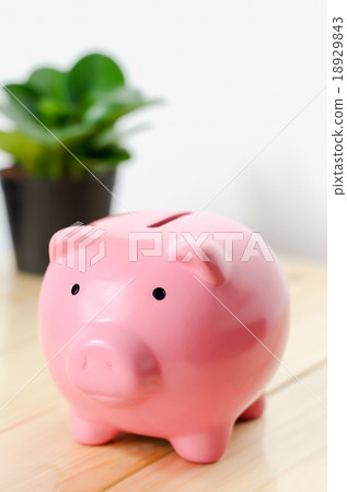 Close up of small pink piggy bank on wooden table 18929843