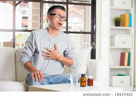 asian senior with stomach pain and medicine asian senior with stomach pain and medicine 18935482