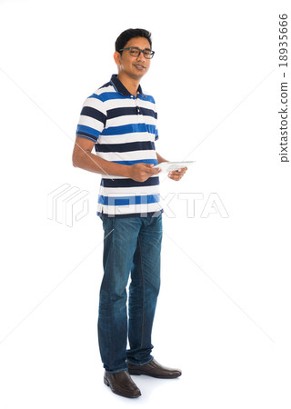 Happy young man using digital tablet 18935666