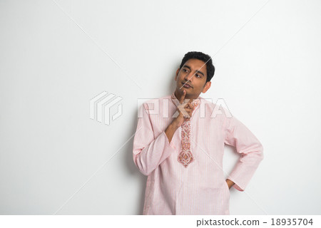 Happy young man using digital tablet Happy young man using digital tablet 18935704