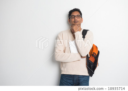 Happy young man using digital tablet Happy young man using digital tablet 18935714