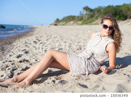 Beautiful girl on a beach 18936349