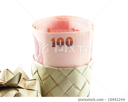 Rolled banknotes on weaved basket Rolled banknotes on weaved basket 18942244