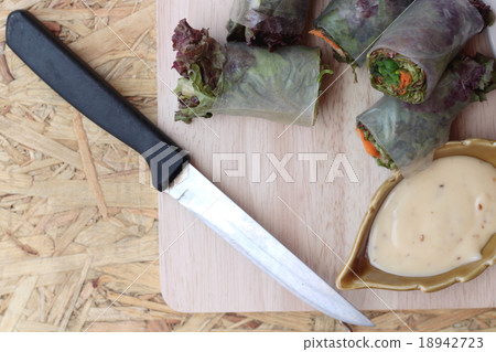 Vegetable salad wrapped into spring rolls Vegetable salad wrapped into spring rolls 18942723