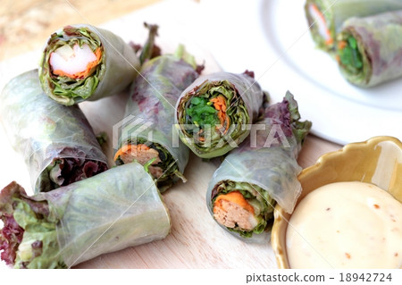 Vegetable salad wrapped into spring rolls Vegetable salad wrapped into spring rolls 18942724
