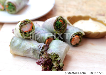 Vegetable salad wrapped into spring rolls Vegetable salad wrapped into spring rolls 18942726