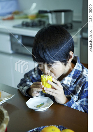 A boy wearing corn 18943060