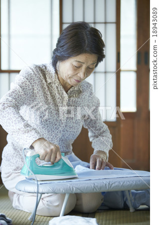 Grandma with ironing 18943089