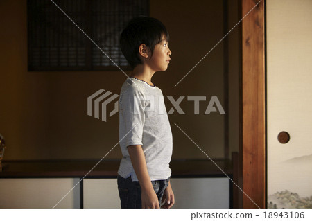 A boy looking outside 18943106