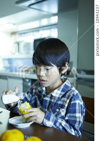 A boy who eats salt with corn A boy who eats salt with corn 18943237