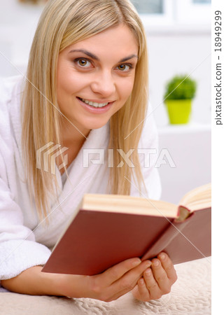 Attractive woman reading a book.  18949299