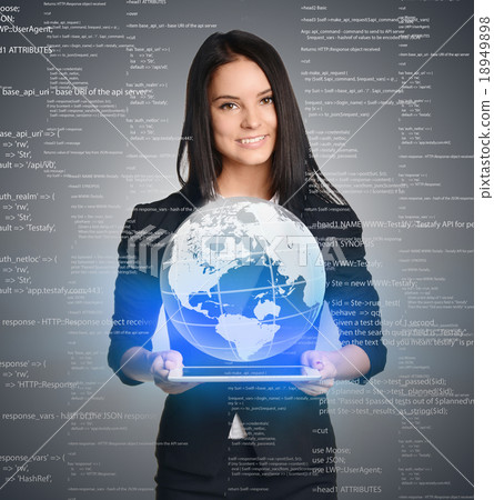 Smiling Girl holding digital globe over tablet Smiling Girl holding digital globe over tablet 18949898