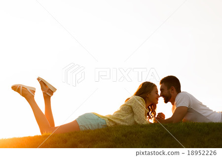 Guy and  girl enjoy each other. 18952226