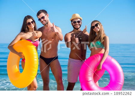 Young people having fun on the beach. 18952262