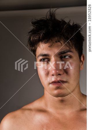Crying man with tears in eye closeup Crying man with tears in eye closeup 18952826