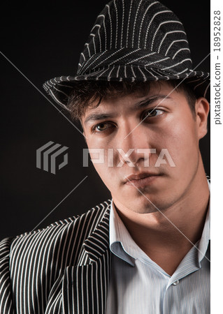 a man in a grey hat on black background a man in a grey hat on black background 18952828