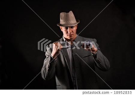 a man in a grey hat on black background a man in a grey hat on black background 18952833