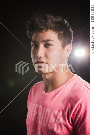 Casual Man isolated on dark background Casual Man isolated on dark background 18952835