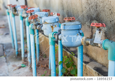 Rusting old water valve with water meter Rusting old water valve with water meter 18956157