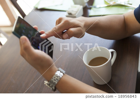 man hand finger playing or sliding on touch screen 18956843