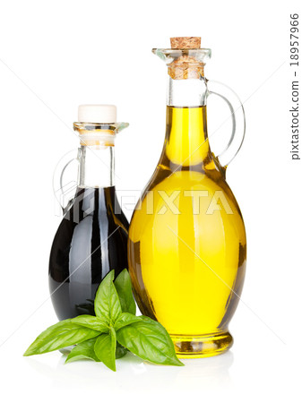 Olive oil and vinegar bottles with basil Olive oil and vinegar bottles with basil 18957966