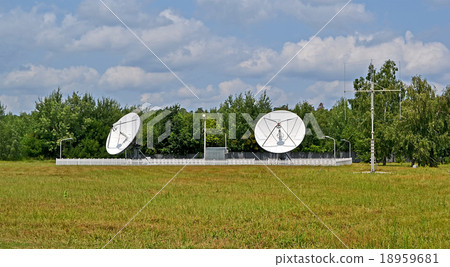 satellite antennas, green trees, blue sky satellite antennas, green trees, blue sky 18959681