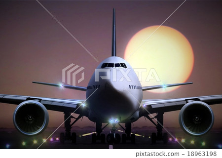 airplane on runaway during sunset 18963198