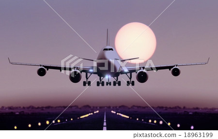 Airplane touch down during sunset 18963199