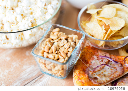 close up of fast food snacks on wooden table 18976056