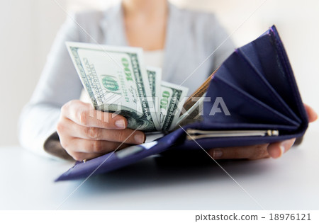 close up of woman hands with wallet and money close up of woman hands with wallet and money 18976121