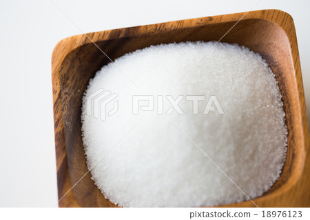 close up of white sugar heap in wooden bowl close up of white sugar heap in wooden bowl 18976123