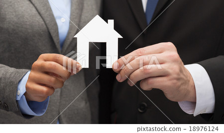 businessman and businesswoman holding white house businessman and businesswoman holding white house 18976124